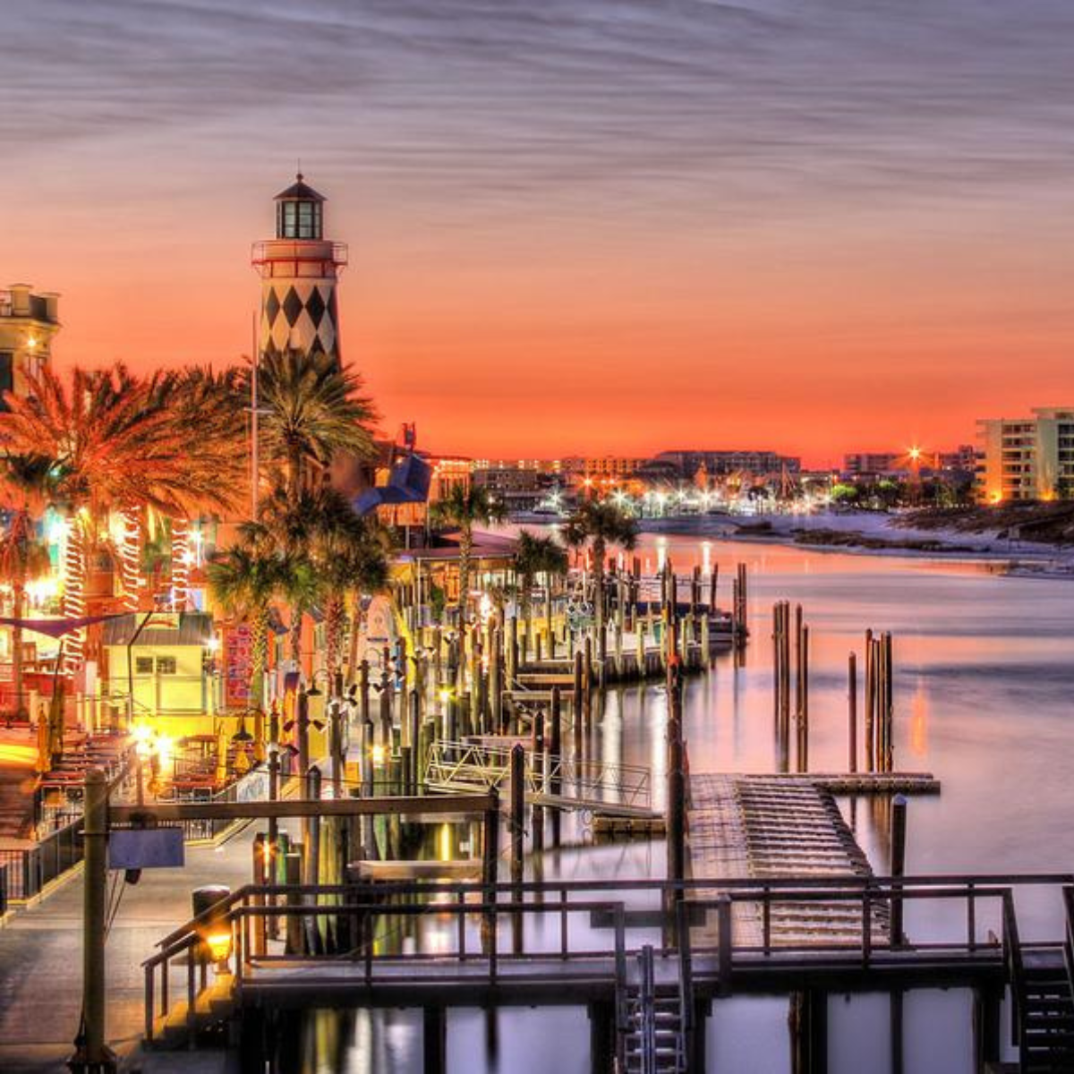Destin Harbor Boardwalk view with boats, restaurants, and waterfront activity in Destin Florida