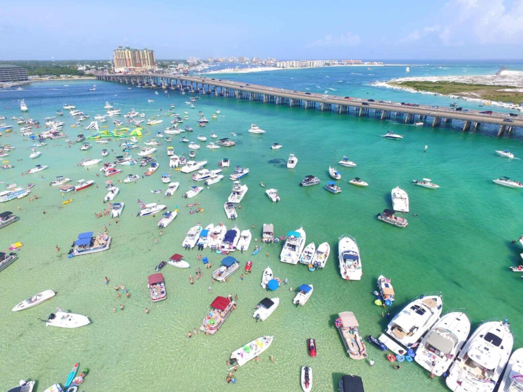 Crab Island sandbar with boats anchored in emerald water near Destin along the Gulf of America