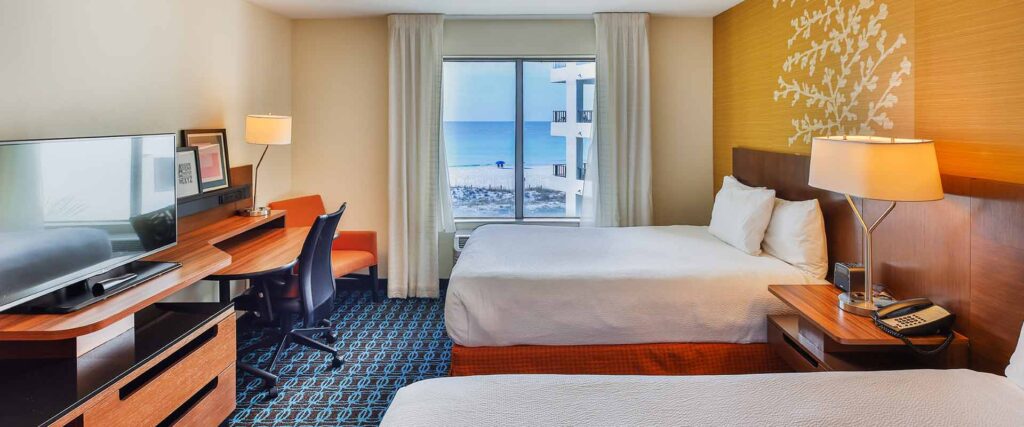 Beachfront room view overlooking Okaloosa Island beach and emerald water