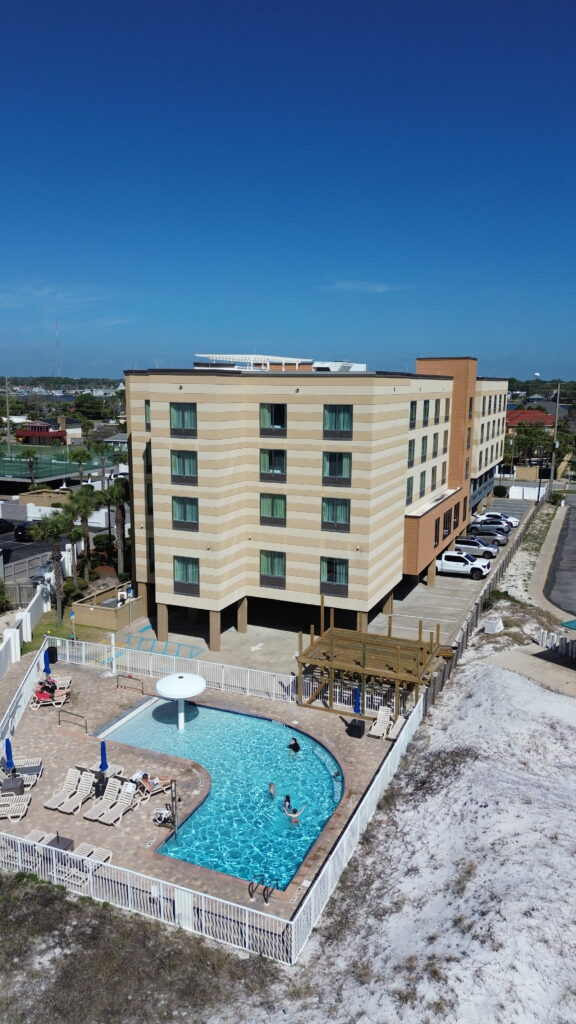 Wavecrest Lodge beachfront hotel with pool on Okaloosa Island overlooking the Gulf of America near Destin Florida