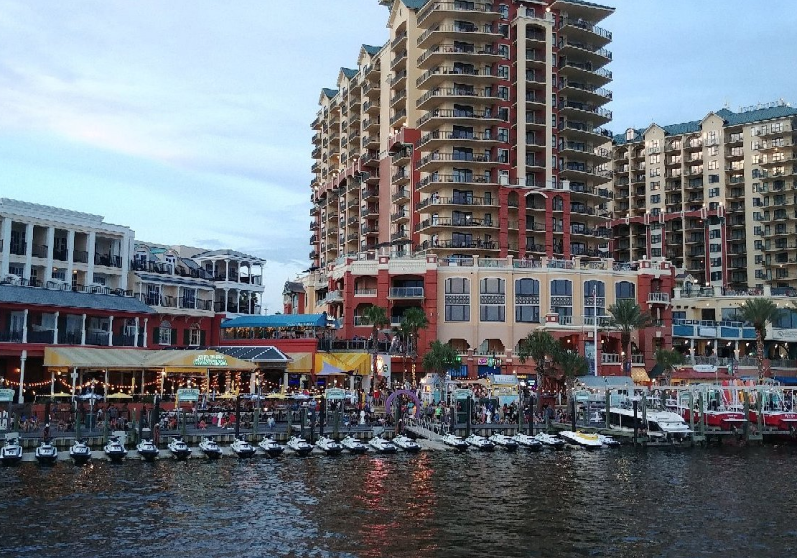 Destin Harbor Boardwalk with waterfront views, boats, restaurants, and shops