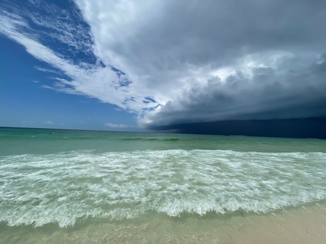 Rain clouds over the emerald water along Okaloosa Island beach near Destin on the Emerald Coast