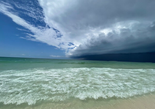 Rain clouds over the emerald water along Okaloosa Island beach near Destin on the Emerald Coast